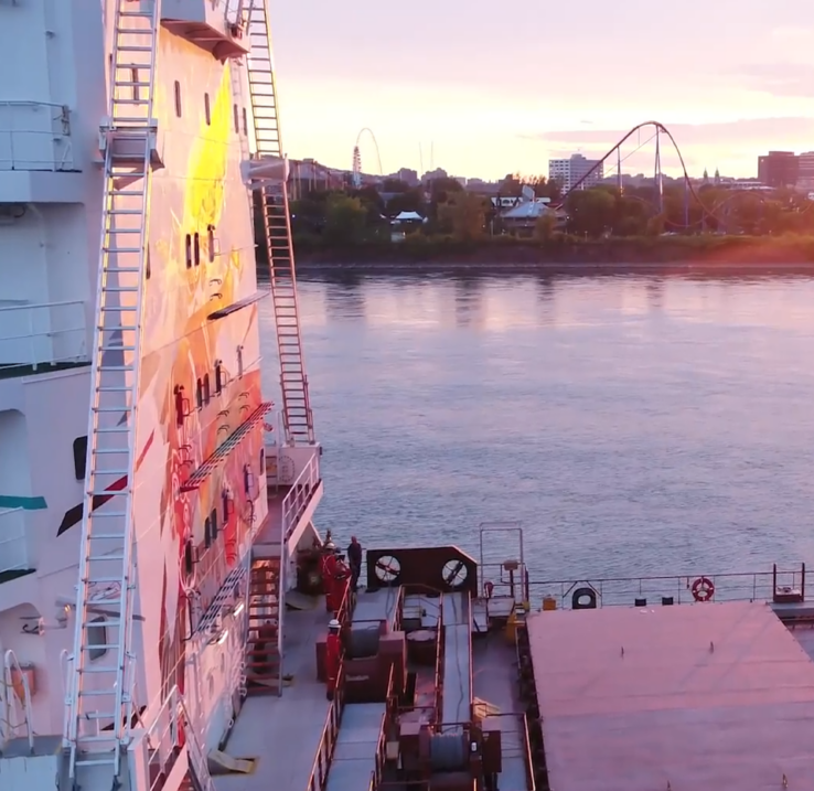 The deck of a cargo ship at sunset